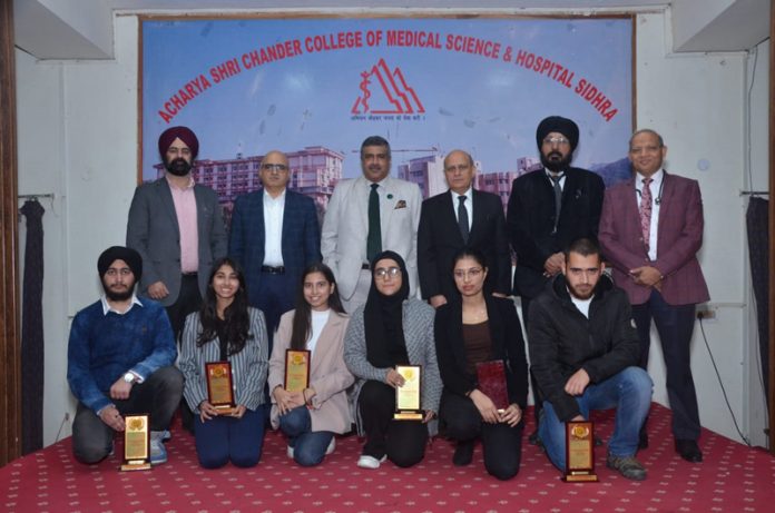 Toppers in Physiology from different medical colleges posing with their HoDs during an event at ASCOMS & Hospital, Jammu.