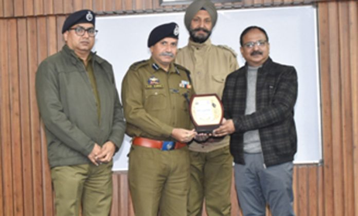 Shiv Kumar, SSP, Principal PTTI Vijaypur felicitating Prof Vinod Sharma during a function held on Saturday.