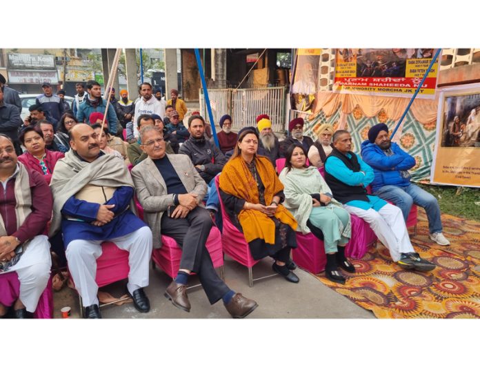 BJP leaders during a Booth Jan Samvad Abhiyan at Ward 45 Jammu on Sunday.