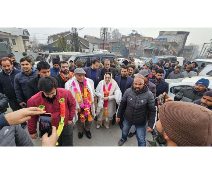 BJP leaders taking new entrants into party fold at Srinagar on Sunday.