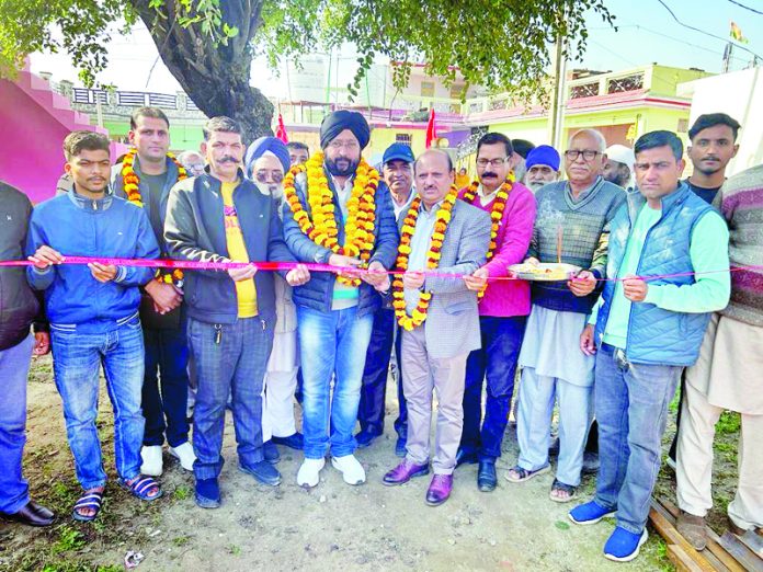 Former Minister and BJP general Secretary, Dr D K Manyal and DDC member, Sarbjeet Singh Johal kick starting construction of community shed at Panchayat Chak Salaria on Saturday.