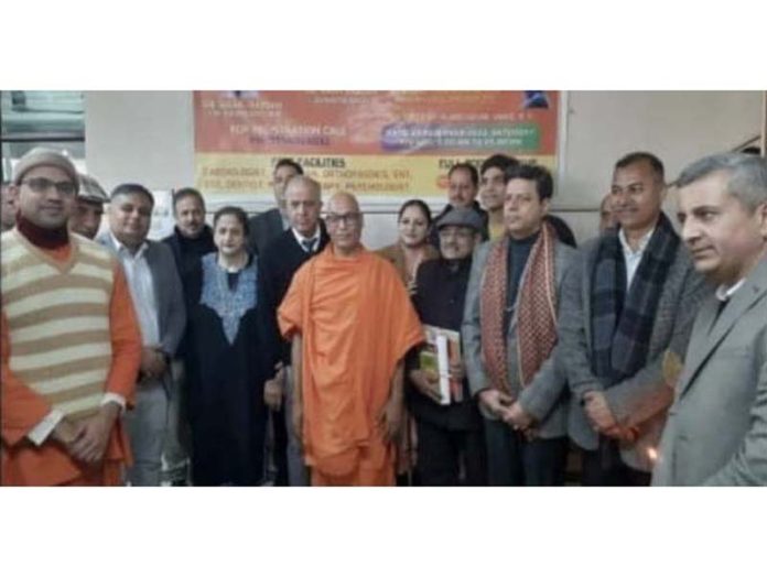 Swami Yajnadharananda (secretary, Ramakrishna Mission Jammu) along with guests during a medical camp.