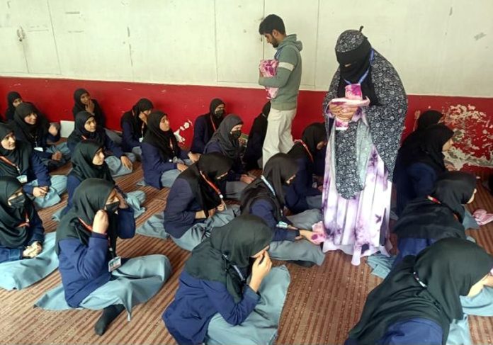 Members of LFO-BHF distributing sanitary napkins among girls of a Government school in Pulwama district.