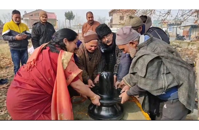 KPs installing Shiva Lingam. — Excelsior/Younis