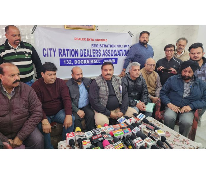 City Ration Dealers Association working president Sanjay Abrol, senior member Vijay Kumar Sharma and other members addressing joint press conference in Jammu on Thursday. -Excelsior/ Rakesh