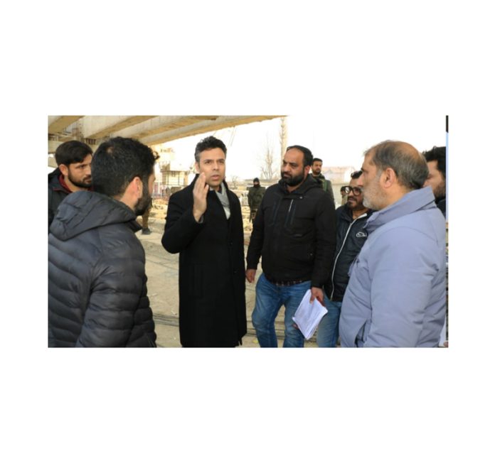 DC Srinagar Dr Bilal Mohi-Ud-Din Bhat during visit to ongoing construction of flyovers at Bemina Junction on Friday.