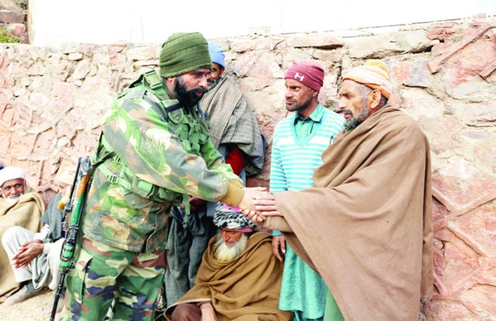 Churunda villager celebrating New Year with the Army on Sunday. - Excelsior/Aabid Nabi