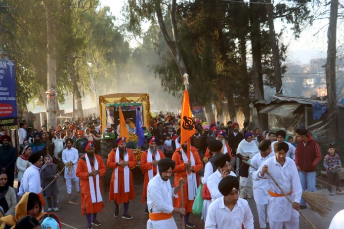 Impressive Nagar Kirtan being taken out by Sikh community members in Poonch town on Monday. -Excelsior/Rahi Kapoor