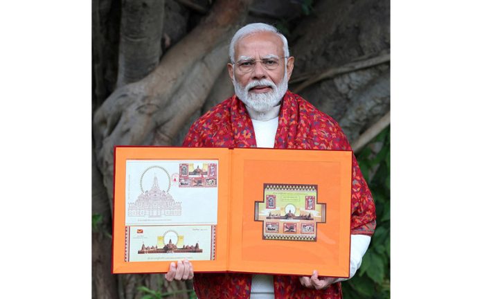 Prime Minister Narendra Modi releases commemorative postage stamps on Shri Ram Janmbhoomi Mandir and a book of stamps in New Delhi on Thursday. (UNI)