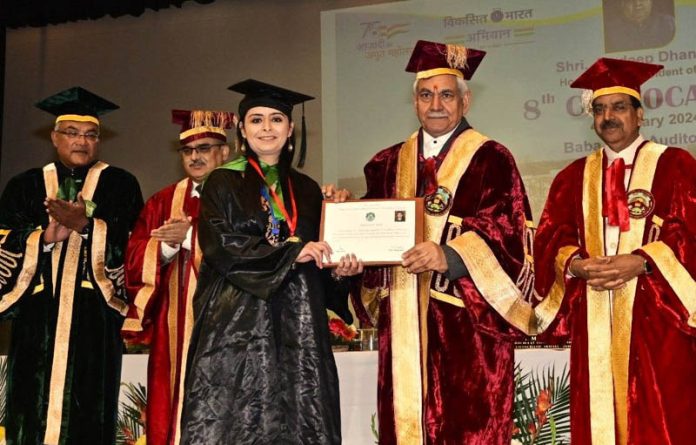 LG Manoj Sinha awarding Gold Medal certificate to a meritorious student during 8th Convocation of SKUAST-J on Thursday.
