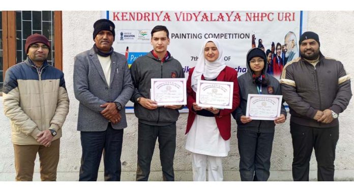 Students posing with certificates during painting competition at Kendriya Vidyalaya NHPC Uri on Tuesday.