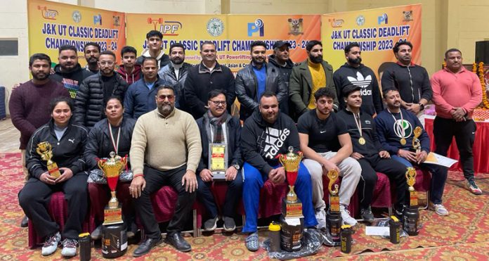 Powerlifters posing with dignitaries during championship at Jammu. 