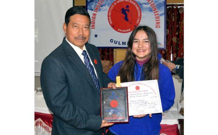 Colonel IS Thapa, Principal IISM presenting certificates of different Skiing courses during a graduation ceremony at Gulmarg. 