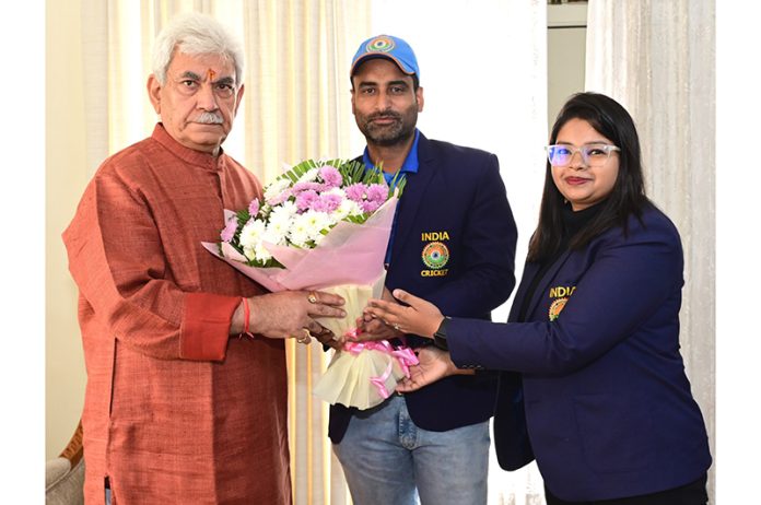 Captain Indian Divyang Cricket Team presenting bouquet to LG Manoj Sinha on Sunday.