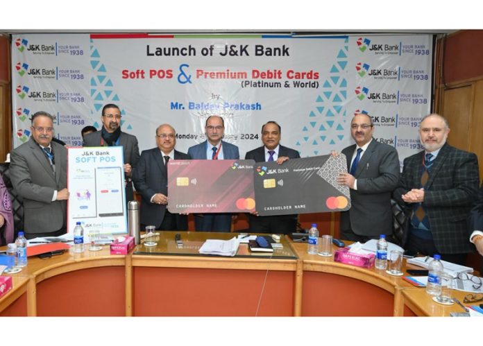MD and CEO of J&K Bank, Baldev Prakash along with senior executives launching the Bank's Soft POS and Premium Debit Cards.