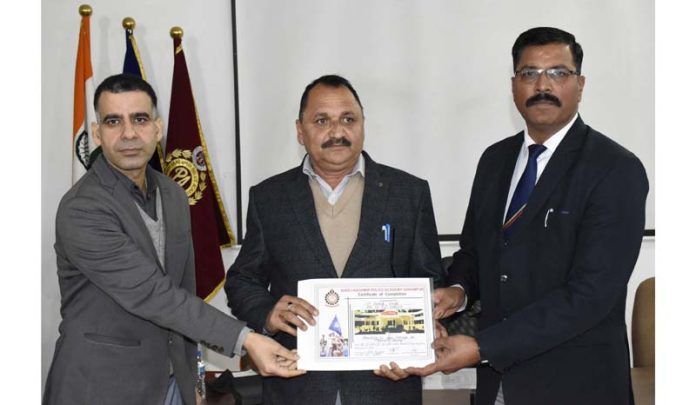 Rakesh Sambyal, Chief Prosecuting Officer, SKPA Udhampur, providing a certificate to a police officer in the Academy on Wednesday.