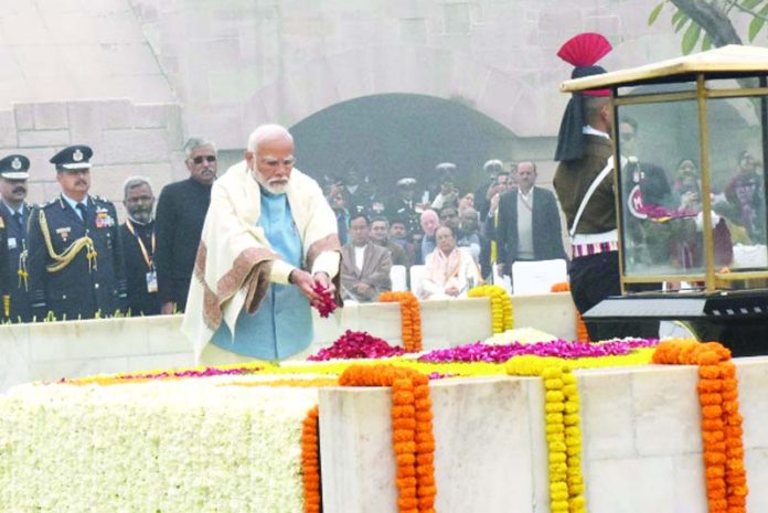 Prime Minister Narendra Modi paying floral tributes to Father of the Nation Mahatma Gandhi at the Gandhi Smriti, on the occasion of the Martyrs’ Day, in New Delhi on Tuesday. (UNI)