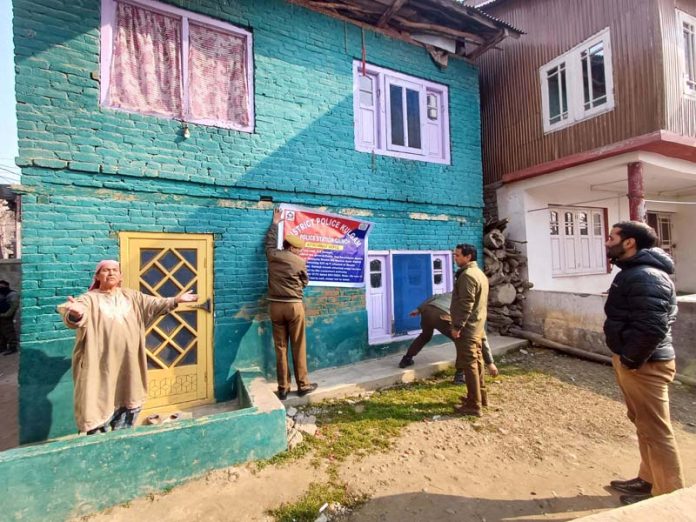 Authorities on Monday seized a two storeyed residential house in Khudwani area of Kulgam district in Kashmir. -Excelsior/Sajad Dar