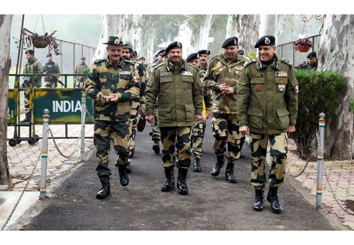 DG BSF Nitin Agrawal flanked by senior officials from Jammu Frontier visiting Octroi BOP in R S Pura sector on Wednesday.