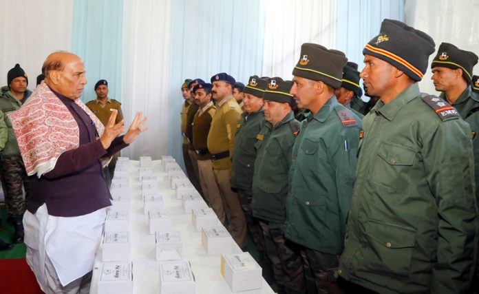 Defence Minister Rajnath Singh meeting jawans at the inauguration of 35 infrastructure projects of BRO at Joshimath-Malari Road in Uttarakhand on Friday. (UNI)