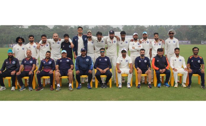 J&K Cricket team posing with management staff.