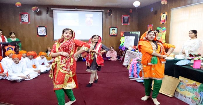 Students of APS Damana presenting a cultural item in school on Monday.