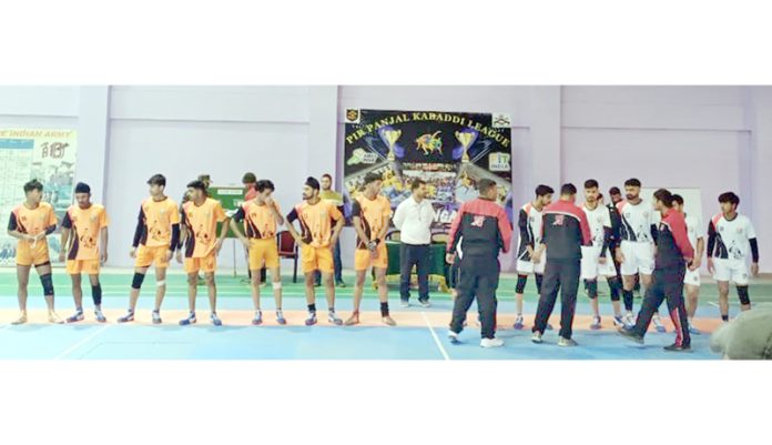 Kabaddi players posing during a match at Sports Stadium Doda on Monday.