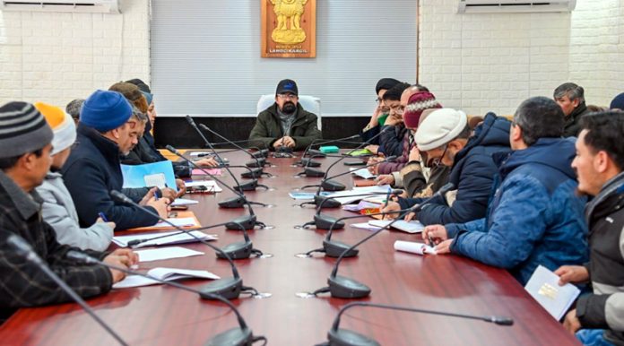 CEC Dr Mohammad Jaffer Akhoon chairing a meeting of the officials in Kargil on Thursday.