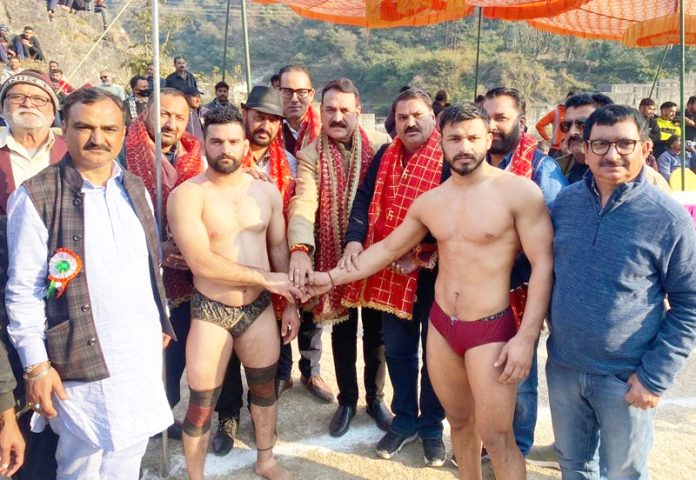 Former Minister Jugal Kishore Sharma introducing wrestlers before bout at Reasi on Wednesday.