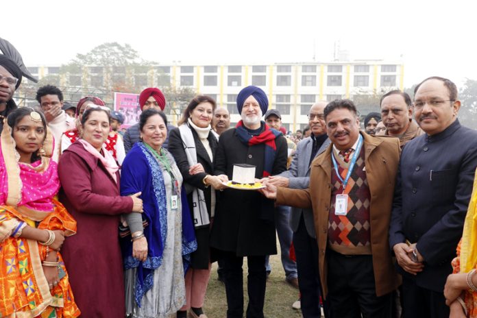 Zora Singh, Chancellor of Desh Bhagat University posing with faculty members during an event on Thursday.