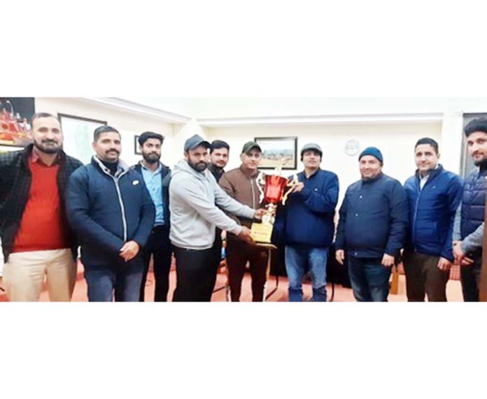Dignitaries presenting trophy to SMVDU cricket team captain during prize distribution ceremony.
