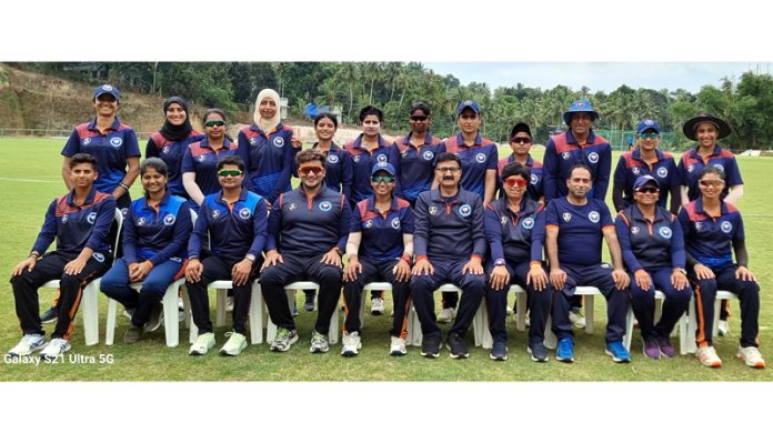 Senior Women's Cricket team of J&K posing for group photograph along with support staff.