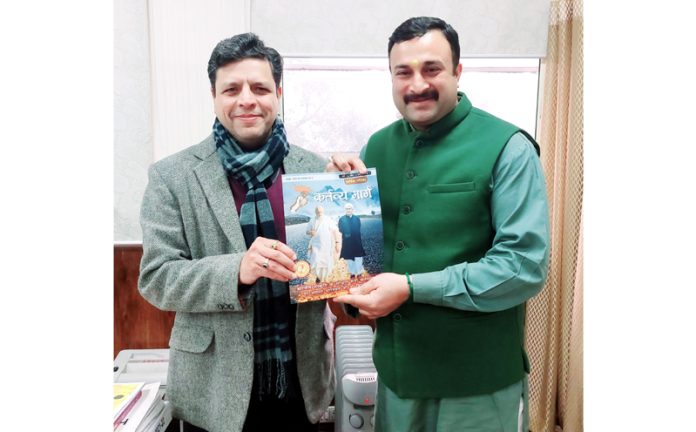 Mahant Rohit Shastri presenting a copy of magazine Kartavya Marg to Commissioner Secretary GAD, Sanjeev Verma, in Jammu on Tuesday.