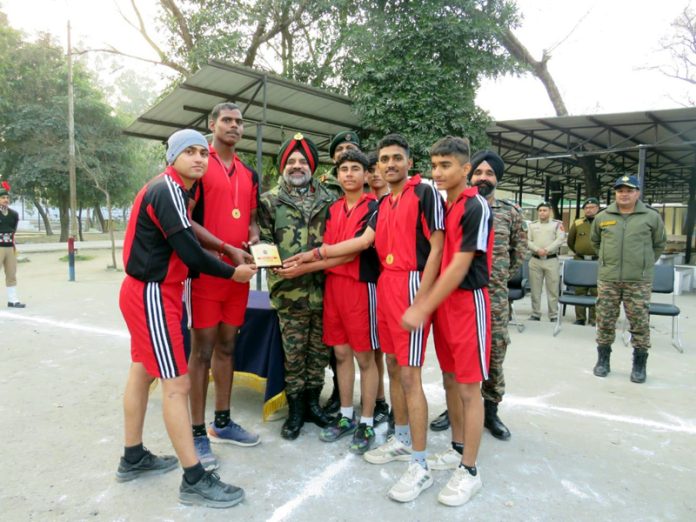 Brigadier PS Cheema, Group Commander NCC Group Jammu presenting prizes to cadets.