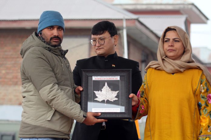Aabid Nabi, Daily Excelsior Staff Photojournalist felicitated by District Administration Baramulla for his contribution in highlighting day to day issues of public importance on the 75th Republic function by DDC Chairperson, Safeena Beigh and DC Baramulla, Minga Sherpa.