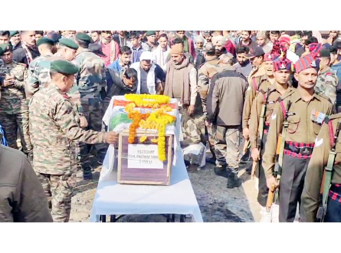 Hundreds of mourners giving touching adieu to martyr, Sepoy Pritam Singh at his native village Msngli in Kathua district on Thursday.