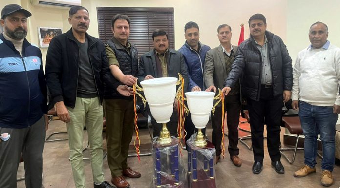 Arun Gupta, President, J&K Veterans Cricket Association along with other dignitaries unveiling 2nd J&K Masters Inter State Cricket League T20 trophy.