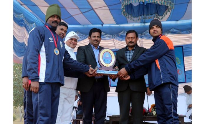 Dignitaries presenting trophy to winner of Triathlon Competition at Jammu on Wednesday.