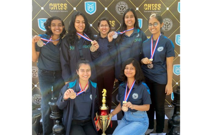 Arushi Kotwal along with other winners displaying medals during a Chess Championship.