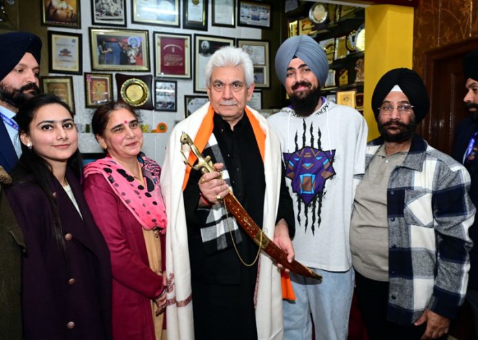 LG Manoj Sinha meeting with the family members of Int’l Para Taekwondo medallist Chandeep Singh at Jammu on Saturday.