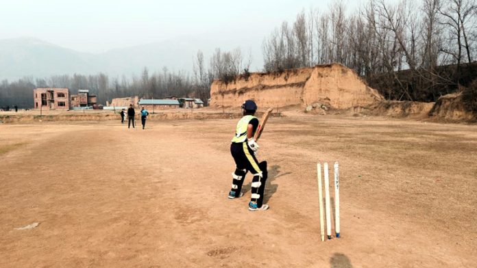 A budding cricketer practicing in Ganderbal Cricket Academy. -Excelsior/Firdous