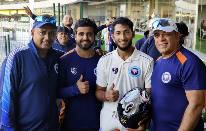 Centurions Vivrant Sharma and Shubham Singh Pundir posing alongwith Head Coach Ajay Sharma and Bowling Coach Krishna Kumar at Vadodara on Saturday.