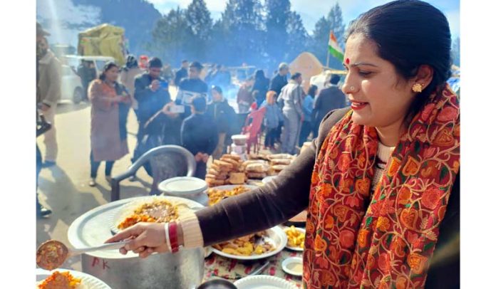 A Bhaderwahi woman serves local food to the visiting tourists. -Excelsior/Tilak Raj