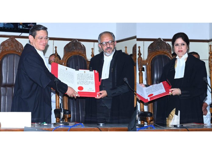 Chief Justice N Kotiswar Singh administering oath of office to Justice Rahul Bharti and Justice Moksha Khajuria Kazmi as Permanent Judges on Monday.