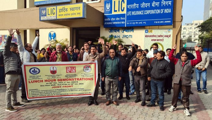 LIC employees raising slogans during a protest demonstration at Jammu on Wednesday.