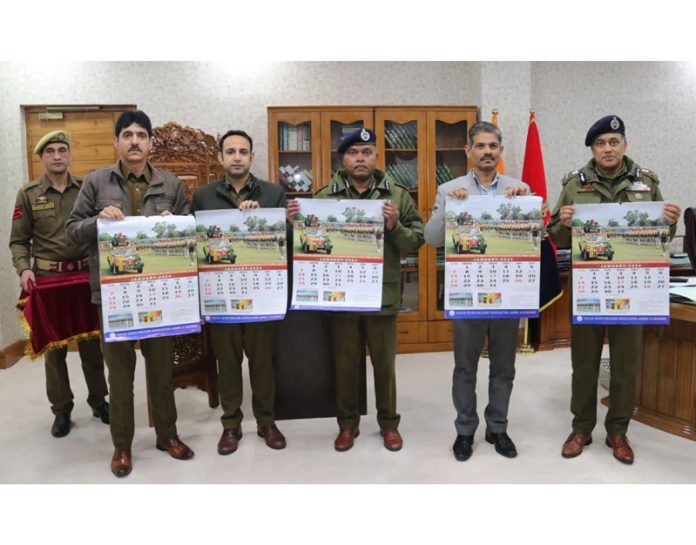DGP RR Swain along with other police officers releasing PWWA’s calendar for the year 2024 at Police Headquarters in Jammu on Tuesday.