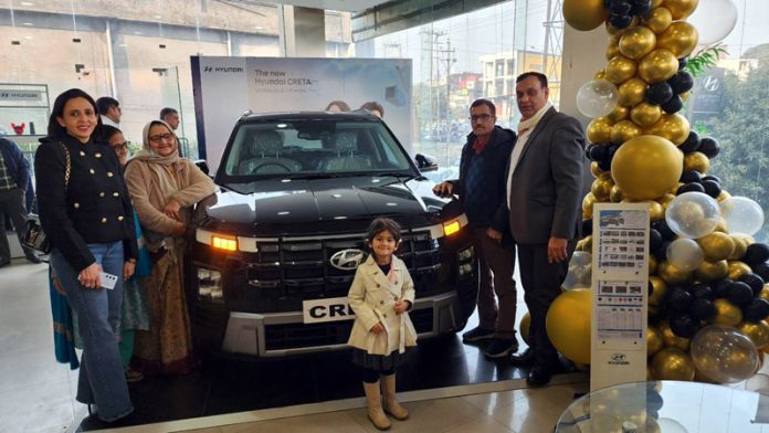 Chairman, MD and Directors of AM Hyundai Group along with their family members on the launch of new Creta at their Narwal showroom in Jammu.