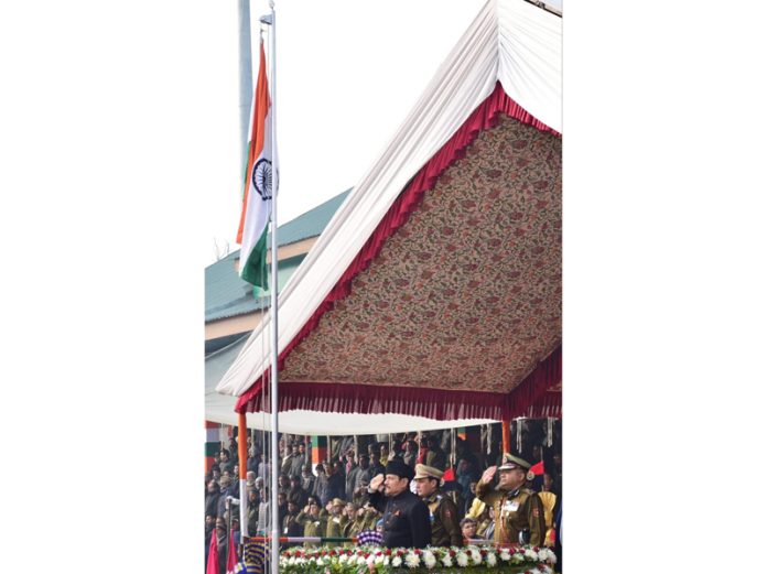 Advisor R R Bhatnagar unfurling National Flag at Bakshi Stadium, Srinagar.