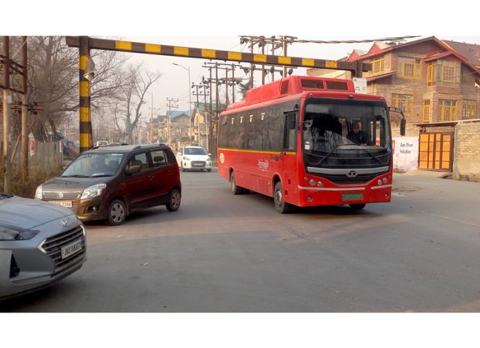 A Red e-bus plying on a city route in Srinagar on Tuesday. — Excelsior/Shakeel