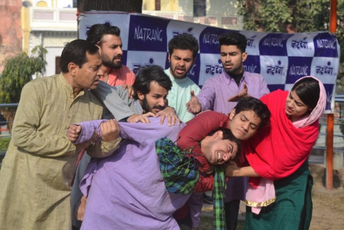 A scene from Hindi play 'Jaal' staged by Natrang at Rani Park in Jammu on Sunday.